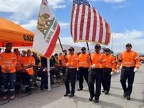 The honor guard arrives at the District 12 workers memorial ceremony.