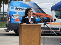 District 12 Director Lan Zhou gives remarks at the workers memorial ceremony.