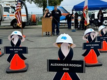 At the District 12 ceremony, Lisa Rodish and Arnold Salas speak on behalf of their brother, Alex Rodish.