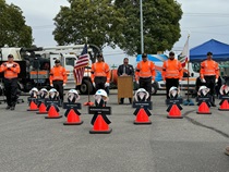 The acting deputy director of Maintenance and Operations reads the names of the fallen at the District 12 ceremony.