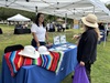 Caltrans District 7 Public Information Officer Diana Jimenez speaks with a Long Beach resident about the Vincent Thomas Bridge Deck Replacement Project.