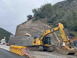  Construction equipment is at work on a retaining wall on state route 20 near Blue Lakes.