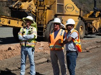 Caltrans project staff and contractors at the site of Konocti Corridor Improvement Project construction. Heavy equipment is visible in the background. 