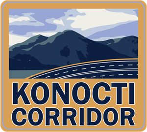 Logo for Konocti Corridor project in Lake County. The words Konocti Corridor are visible beneath a mountain landscape with clouds overhead. A four-lane road begins on the left and curves up to the right.