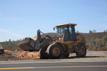 A bulldozer operator works on the konocti corridor improvement project.