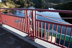 The bridge project design features steel salmon artwork welded onto both bridge railings