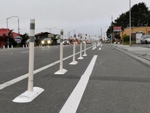 Delineators mark temporary bike lanes on northbound Broadway in Eureka, California. 