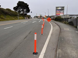 Delineators mark a temporary closure of the deceleration lane at the southern entrance to the Bayshore Mall on Broadway in Eureka.