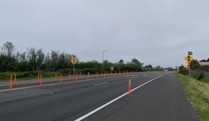 Delineators mark temporary closure of a median in south Eureka, California to evaluate a potential median refuge in this area. 