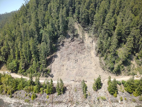 Aerial photo of the slide area on Route 36 in Humboldt County. The hillside is sliding down onto the roadway below. 