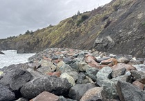 Large boulders fortify the slope along the beach underneath Route 1 in Mendocino County.