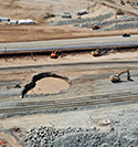 Drone image of the Niland Geyser Mitigation Project showing a large opening hole by the road and next to train tracks