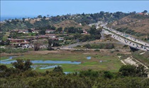 Figure SB-02I — Northern View from Public Trail Toward San Elijo Lagoon from Solana Hills Drive. For more information call (619) 688-6670 or email CT.Public.Information.D11@dot.ca.gov