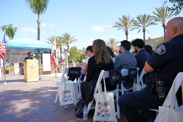 Fullerton Mayor Fred Jung speaks in front of elected officials, city staffers, and local residents.