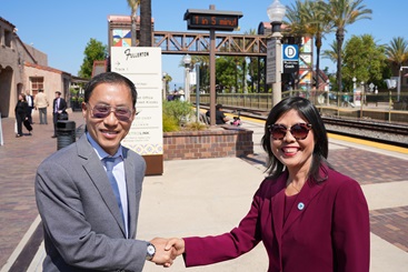 Fullerton Mayor Fred Jung and Caltrans District 12 Director Lan Zhou celebrate their partnership and joint accomplishment of the newly restored Fullerton Transportation Center.