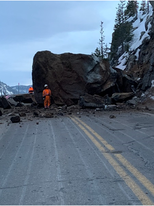 Image of a massive boulder two stories high and three stories wide is blocking westbound and eastbound US-50 at Echo Summit in El Dorado County. Motorists heading to the Sierra expect delays.