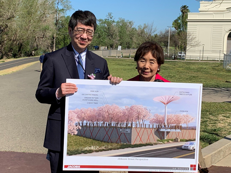 Photo of Japanese Consul General Hiroshi Kawamura and Congresswoman Doris Matsui holding artist rendering of the Hanami Line