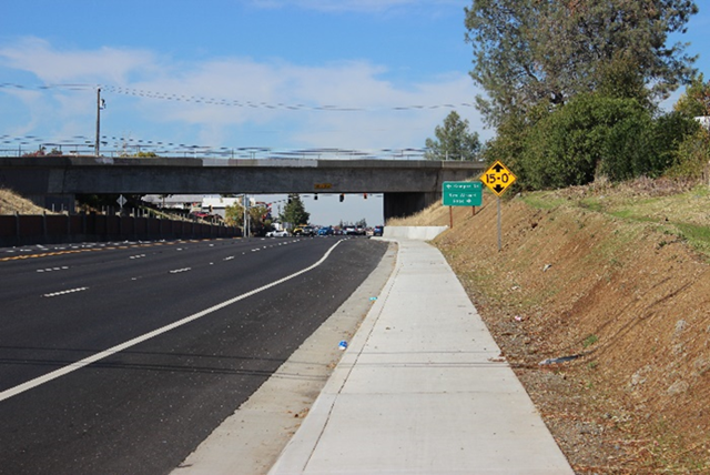 Photo of State Route 49 northbound near Hulbert Way and the railroad overcrossing. Photo taken after Caltrans installed a sidewalk and widened shoulders to improve pedestrian and bicycle movement.