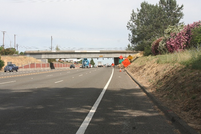 Photo of State Route 49 northbound near Hulbert Way and the railroad overcrossing. Photo taken before Caltrans installed a sidewalk and widened shoulders to improve pedestrian and bicycle movement.