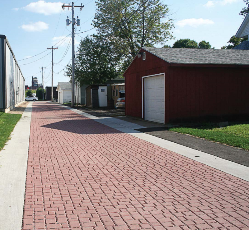 Rendered image of the Dixieanne Neighborhood Clean and Green Alleys Project that will transform at least 3,000 feet of unpaved residential alleys by removing debris, installing permeable pavers, planting shade trees, repairing dilapidated fences, removing gates and commissioning art in public places. 