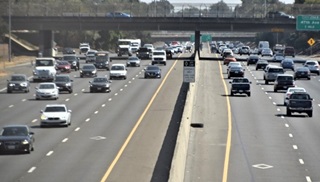 Photo of the diamond shape painted on the pavement of the #1 (left) lanes on northbound and southbound Highway 99 symbolizing the HOV (carpool) lanes. 