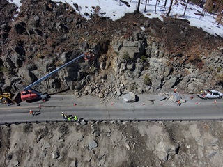 An aerial view of rock scaling activities at Echo Summit on U.S. Highway 50 heading to South Lake Tahoe. Heavy equipment assists with scaling activities.