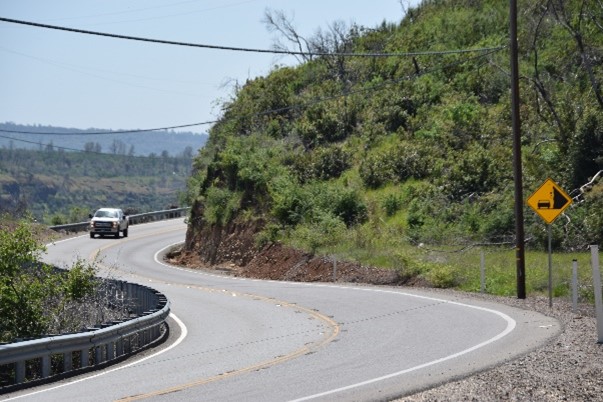 image of car driving in winding highway