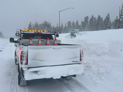 Caltrans truck dusted with snow after a blizzard hit Donner Summit in March 2024.