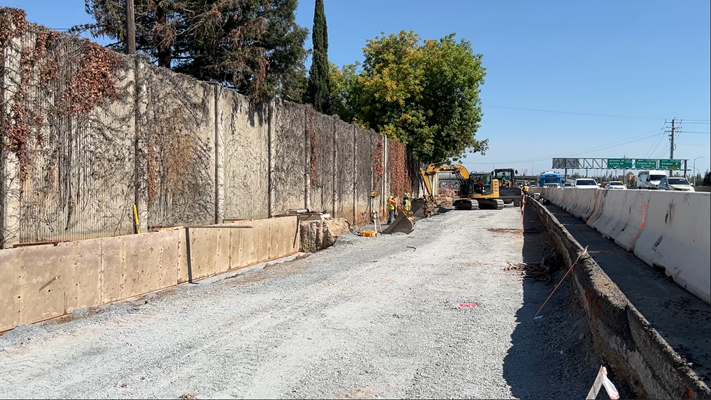 Crews excavating along shoulder of westbound Interstate 80 in Roseville to make room for the new fifth lane between Douglas Blvd and Riverside Ave.