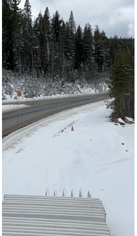 Snow covered Interstate 80 which temporary k-rail moved to the shoulder as part of winterizing a project.