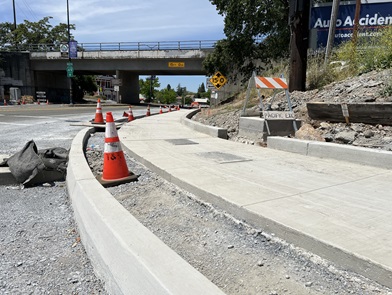 New sidewalk partially constructed along State Route 49 in Auburn as part of the American Canyon Roundabout Project.