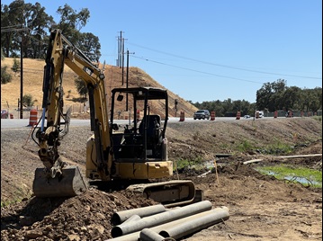 Crews working on drainage ditch along State Route 49 in Placer County as part of a safety barrier project
