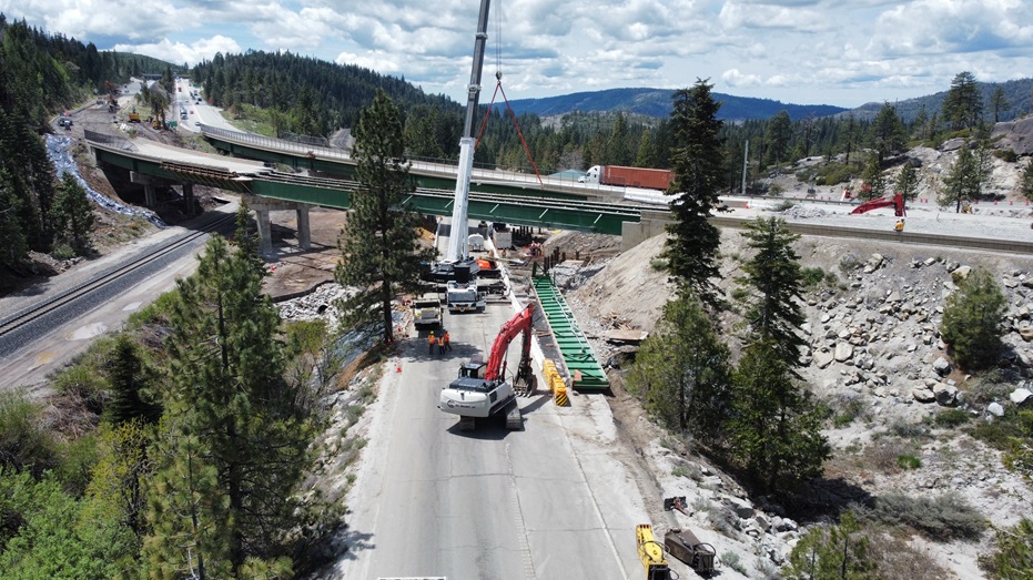 Construction crews working to demolish the eastbound span of the Yuba Pass Separation Overhead Bridge at the junction of Interstate 80 and State Route 20.