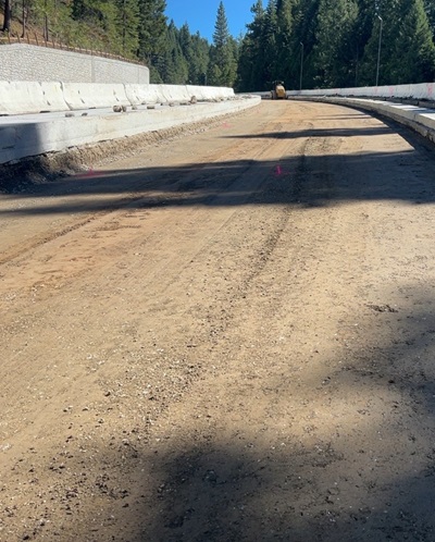 Old median concrete barrier and pavement being removed along Interstate 80 so that new one can be build in a new location to allow for eastbound truck climbing lane.