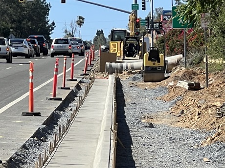 Freshly poured concrete curb along State Route 49 in Auburn as part of a sidewalk gap closure project.