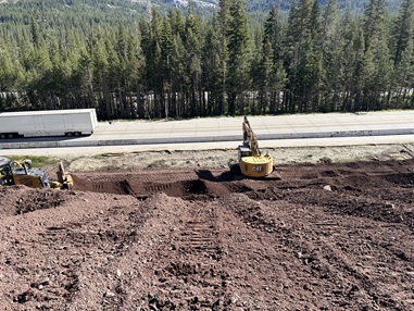Construction crews performing work within the center median along Interstate 80 near Soda Springs as part of a pavement rehabilitation project.