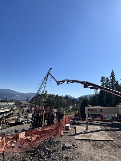 Construction crews making preparations for the installation of concrete girders for the new eastbound bridge along Interstate 80 at the junction with State Route 20 in the Sierra Nevada.
