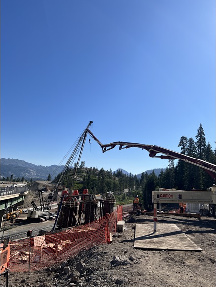 Construction crews making preparations for the installation of concrete girders for the new eastbound bridge along Interstate 80 at the junction with State Route 20 in the Sierra Nevada.