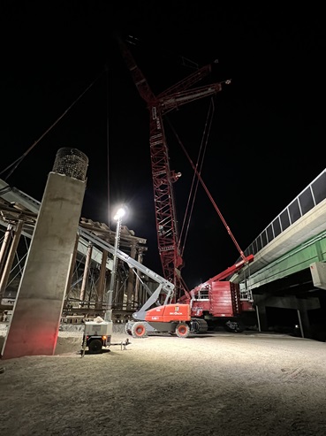 Crews installing new concrete girder along the new eastbound bridge span of the Yuba Pass Separation Overhead Bridge along Interstate 80 in the Sierra Nevada.