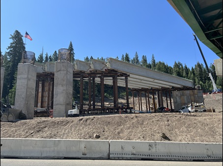 Six concrete girders installed along Interstate 80 in the Sierra Nevada as part of construction of the new Yuba Pass Separation Overhead Bridge.