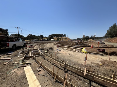 Frame work for new sidewalks, curb and gutters along State Route 49 at Lone Star Road.
