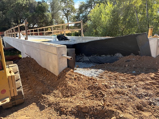 Concrete work along State Route 49 in Auburn on the new pedestrian bridge over Rock Creek.