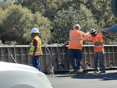 Crews constructing new concrete center barrier along State Route 49 in Placer County.
