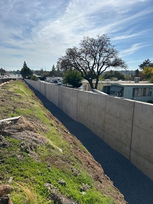 New retaining wall along State Route 49 as part of a sidewalk gap closure project in Auburn.