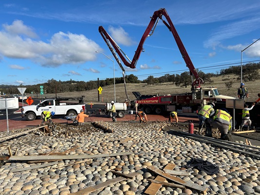 Crews adding cobble stone to new roundabout along State Route 49 in Placer County.