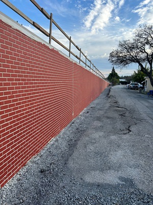 New stamped retaining wall along State Route 49 in Auburn as part of a sidewalk gap closure project.