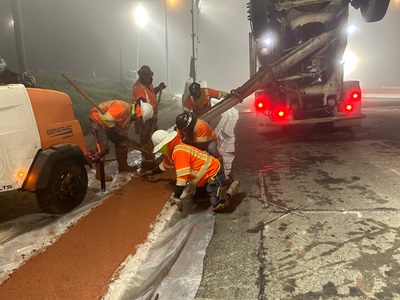 Crews working on concrete curb and splitter island for new roundabout in Auburn at the intersection of State Route 49 and Lincoln Way/Borland Avenue.