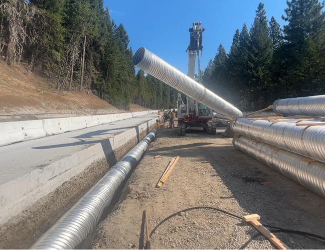 Crews installing underground pipe for drainage of stormwater along Interstate 80.