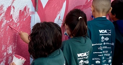 image of kids painting the walls 