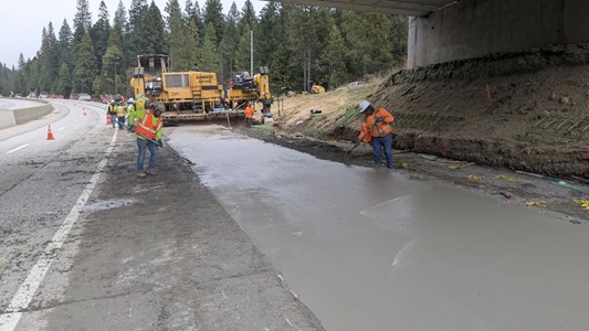 Crews pouring about 5,000 ft length of concrete pavement eastbound I-80 for new truck climbing lane at Baxter.